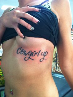 a woman's stomach with the words congraty tattooed on her side,