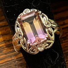 Beautiful Sterling Silver 8mmx12mm Emerald Cut Ametrine With Accent White Topaz. Shank Has Scroll Work On Each Side. Ring Weighs 5.8 Grams. And Is A Size 6 Ametrine Ring, Scroll Work, Multi Stone Ring, Multi Stone, White Topaz, Womens Jewelry Rings, Emerald Cut, Sterling Silber, Stone Rings