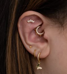 a close up of a person with ear piercings