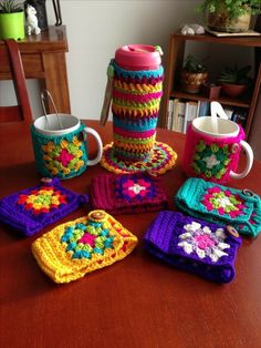 crocheted coffee cups and mug cozyies on a table