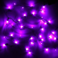 purple lights are lit up in the dark