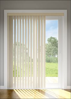 an open window with white vertical blinds in front of the sliding glass door that leads to a grassy field