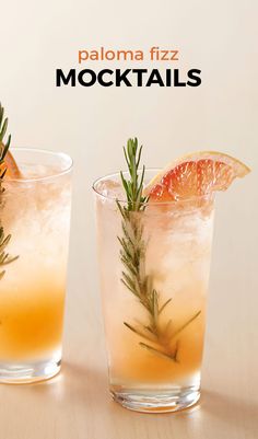 two glasses filled with orange juice and garnished with rosemary