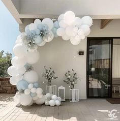 balloons and flowers decorate the entrance to a house