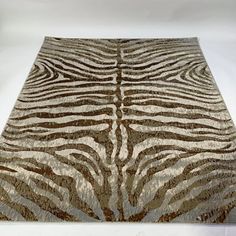 a brown and white zebra print rug on a white background with room for text or image