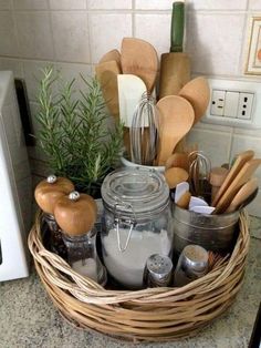 a basket filled with kitchen utensils on top of a counter