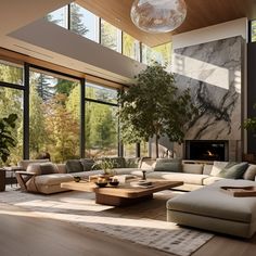 a living room filled with lots of furniture next to large windows and a fire place