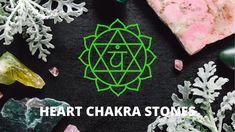 the words heart chakra stones surrounded by crystals