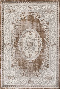 a brown and white rug with an ornate design