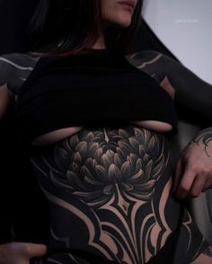 a woman with a tattoo on her stomach