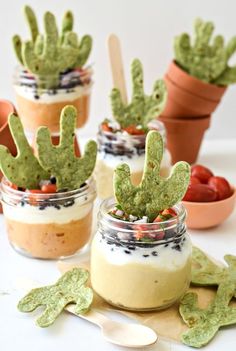 small jars filled with food and cactus decorations