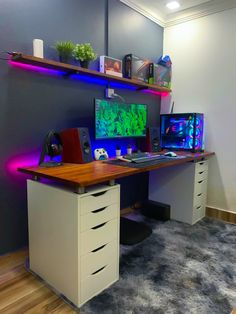 a computer desk with two monitors on it