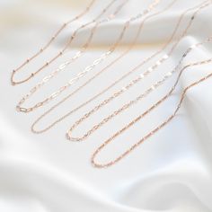 "A light and dainty, single chain necklace made of all 14K rose gold filled materials. Choose the chain style you like and customize the length. For half inch or extra short/long chains, simply leave a note at checkout. 14K Rose Gold-filled, tarnish-resistant, and water-resistant. Lengths 13 inches and under will come with an additional 2 inch extension meaning you can adjust the necklace to be lengths 13 - 15 inches so you can be confident it'll fit your neck perfectly and comfortably. You can Rose Gold Chain Necklace With Adjustable Chain For Everyday, Rose Gold Adjustable Chain Necklace For Everyday, Delicate Rose Gold Cable Chain Necklace, Minimalist Rose Gold Chain Link Necklace, Everyday Delicate Rose Gold Chain Necklace, Rose Gold Cable Chain Necklace For Everyday, Everyday Rose Gold Cable Chain Necklace, Dainty Rose Gold Necklace With Paperclip Chain, Dainty Rose Gold Paperclip Chain Necklace