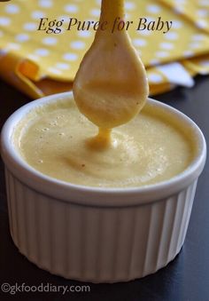 an egg being drizzled into a small bowl