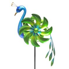 a blue bird is standing on top of a green plant