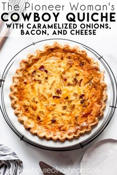 a close up of a pie on a plate with the words cowboy quiche and bacon and cheese