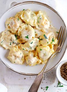 a white bowl filled with macaroni and cheese