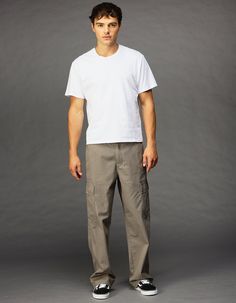 Rsq Loose Cargo Pants. Button Waist Paired With Zipper Fly. Cargo Pockets On Both Legs. Side Slip Pockets. Back Pockets With Button Closure. Approx. Leg Opening: 20". Machine Wash. 100% Cotton. Imported. Mens Cargo Pant Outfit, Casual Cotton Cargo Jeans With Button Closure, Relaxed Fit Wide Leg Cargo Pants With Button Closure, Casual Work Pants Trousers With Belt Loops, Casual Relaxed Fit Pants With Button Closure, Casual Work Trousers With Belt Loops, Loose Fit Outfit Men, Casual Full-length Work Pants With Belt Loops, Relaxed Fit Overalls With Pockets