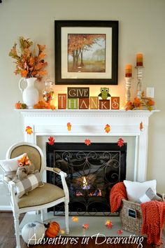 a living room filled with furniture and a fire place covered in fall leaves on top of a mantel