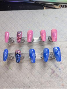 five different colored nail tips sitting on top of a table