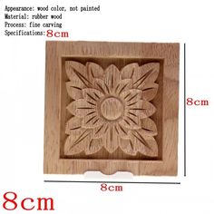 a wooden box with a carved flower on it