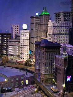 a city at night with lots of tall buildings