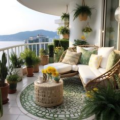 the balcony is decorated with potted plants and wicker furniture