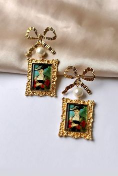 Are you looking for the perfect oil painting earrings for someone special this summer? Or a unique pair of vintage bow earrings to spoil yourself? Made with stainless steel pins, delicate pearl beads and repurposed vintage portrait charms, my coquette earrings are the perfect compliment to any outfit idea! My portrait earrings are a great gift idea for any special occasion to all the women in your life. You can't go wrong when gifting my antique pearl earrings to your bestie, wife or sister! DET Portrait Earrings, Coquette Earrings, Painting Earrings, Earrings Outfit, Portrait Oil Painting, Portrait Vintage, Vintage Portrait, Vintage Style Earrings, Earrings Antique