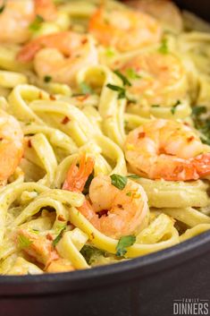 pasta with shrimp and parsley in a pan