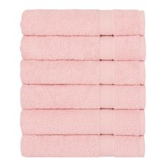 six light pink towels stacked on top of each other in front of a white background