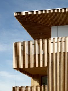 a wooden building with balconies on the side