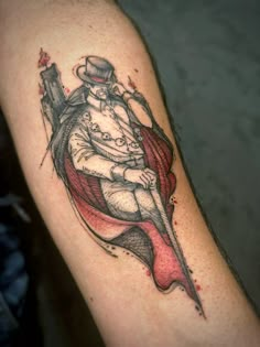 a man's arm with a tattoo on it that has a drawing of a person sitting in a chair