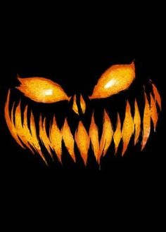 an image of a scary pumpkin face with glowing eyes