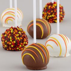 there are many different types of cake pops on this photo and it looks like they were made from candy