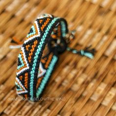 a close up of a bracelet on a table