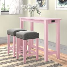 two stools and a table in a room