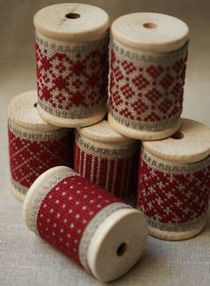 several spools of thread sitting next to each other on top of a table