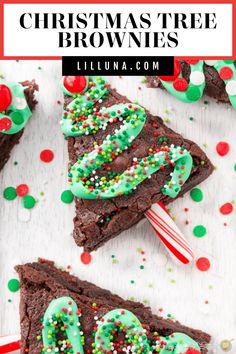 chocolate christmas tree brownies with green and red sprinkles on top, surrounded by candy canes