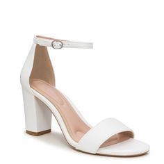 Flaunt your classic style sense with these women's Kelly & Katie Hailee white dress sandals. Crafted with synthetic upper, these ankle strap sandals come with round open toe design, adjustable ankle strap with buckle closure for a precise fit, faux leather lining and cushioned footbed for maximum comfort. Durable synthetic sole and trendy block heel complete this silhouette. This style is exclusive to Designer Brands Canada. | Kelly & Katie Women's Hailee Dress Sandal in White Size 7. 5 Medium Prom Shoes White, Cute White Heels, Grad Fits, White Dress Sandals, Trendy Block Heels, Grade 9, Grade 8, Dress Inspo, White Heels