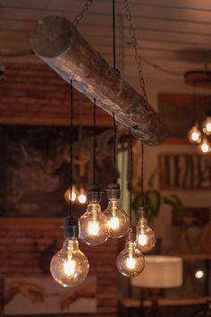 some light bulbs hanging from a ceiling in a room