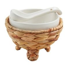 a basket with two bowls sitting on top of it