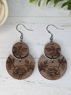 "These unique walnut flower earrings are will go with any outfit. These wooden earrings are lightweight and comfortable, that you'll forget that you're even wearing them. I assure you that you will receive many compliments. ❤️ These walnut earrings will be a lovely gift for your family, friends and coworkers. I know they will love these earrings. Measurement:  L 1.75\" x W 1.25\"  Drop length 2.75\" The hooks are hypoallergenic and nickel free. You can choose from stainless steel, antique bronze, silver 925 and Gold filled hooks. All my handmade jewelry are made by me and my home studio. They are made with dedication and love. Please feel free to message me with any questions you may have. Enjoy free shipping to the US when you spend $35 + at my shop. Check my entire shop for more designs Friends Earrings, Wooden Earrings Handmade, Laser Engraved Earrings, Laser Crafts, Laser Cut Decor, Laser Cut Wood Earrings, Laser Cut Wood Crafts, Laser Projects, Laser Ideas