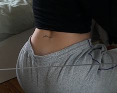 a woman with a tattoo on her stomach