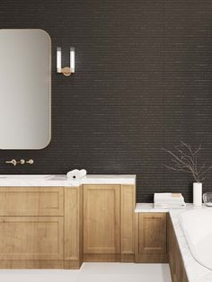 a bathroom with two sinks and a large mirror on the wall next to a bathtub