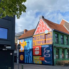 there is a building that has been painted with colorful designs on the outside and inside