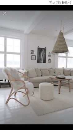 a living room filled with furniture and white walls