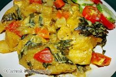 a white plate topped with pasta and veggies