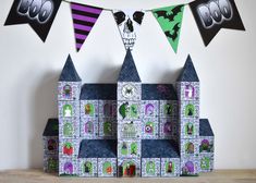 a castle made out of paper and decorated with halloween decorations