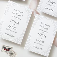 the wedding stationery is laid out on top of each other