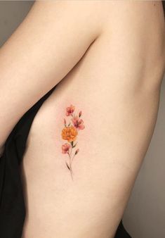 a woman's back with flowers painted on it